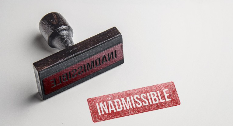 Red “Inadmissible” stamp symbolizing immigration inadmissibility cases handled by Venko Law Firm’s Ottawa immigration lawyers.
